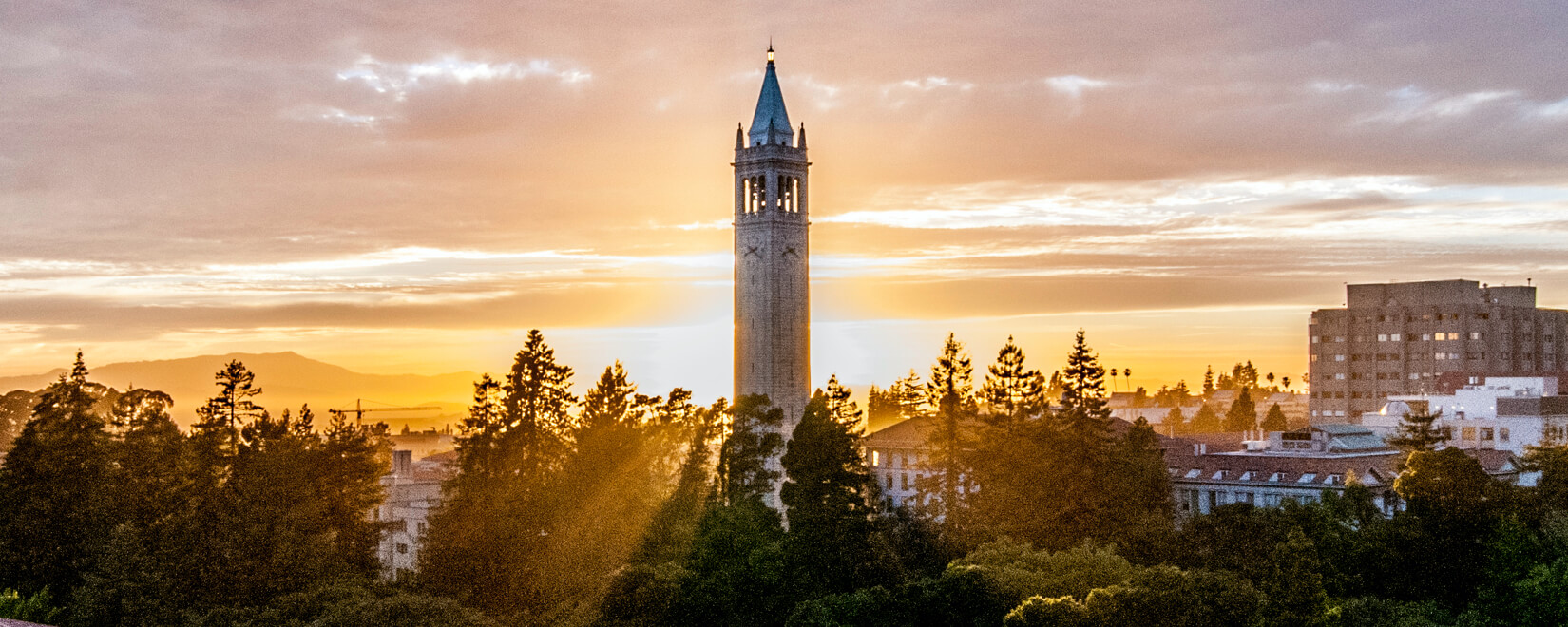 tower in front of sun setting